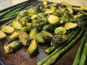Oven baked brussels sprouts with minced garlic and olive oil and some spears of asparagus.